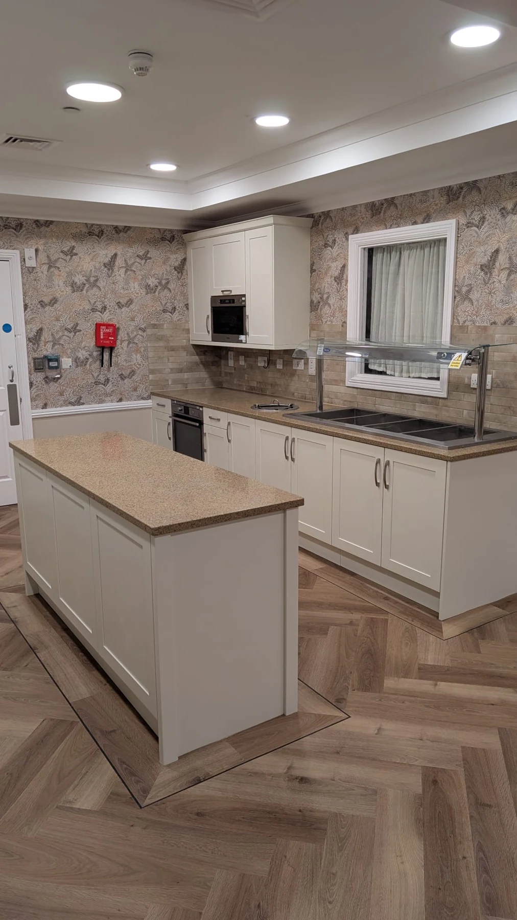 The completed kitchen island and coordinated cabinetry