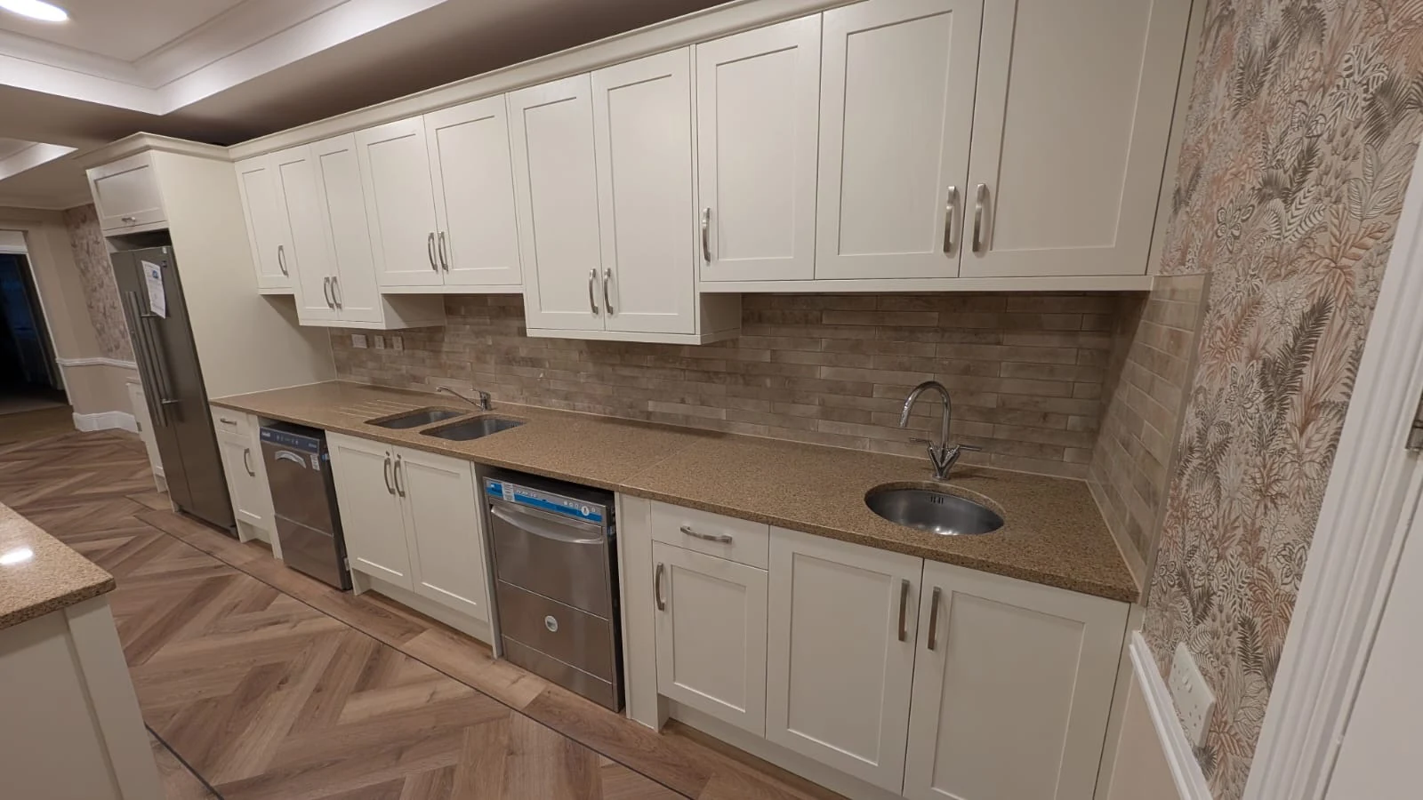 New kitchen units integrated with the existing granite worktops and appliances